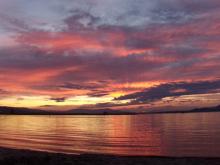 Grey and pink clouds at sunset.